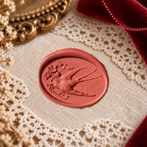 Swallow with Spring Blossom wax seal impression showing a flying swallow beside a flowering branch
